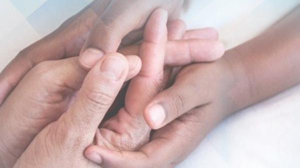 Close up image of holding hands